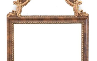 An Altona walnut mirror with giltwood carvings. Mid-18th century. H. 105 cm....