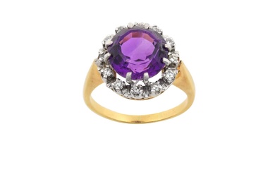 An Amethyst and Diamond Cluster Ring the round cut amethyst...