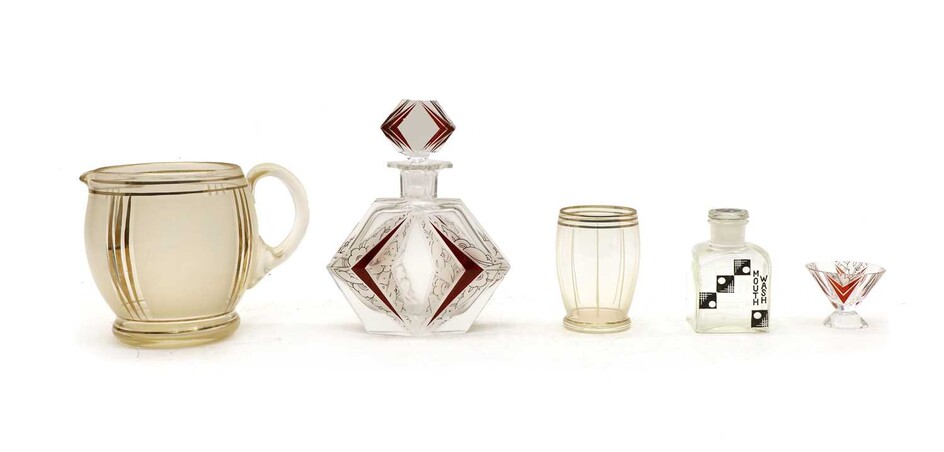 An Art Deco clear glass and cranberry liqueur set
