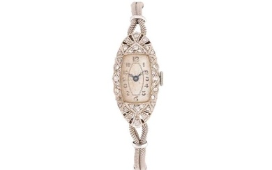An Art Deco lady's cocktail watch, the navette-shaped case set with single-cut diamonds and surround