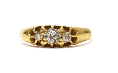 An Edwardian gold three stone diamond ring