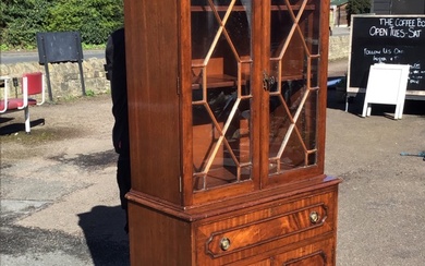 An Edwardian mahogany Georgian style secretaire bookcase with dentilled cornice...