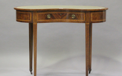 An Edwardian mahogany kidney shaped writing table, crossbanded in satinwood, fitted with a single fr