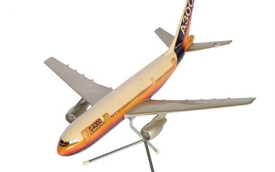 An aircraft manufacturers desk top model of an Airbus A300 passenger plane