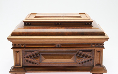 An early 20th century baroque walnut veneered casket.