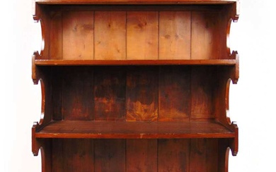 An early 20th century walnut open bookcase with display case...