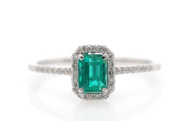 NOT SOLD. An emerald and diamond ring set with an emerald weighing a total of...