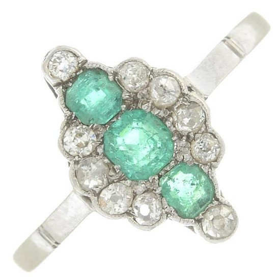 An emerald and diamond ring.Estimated total diamond