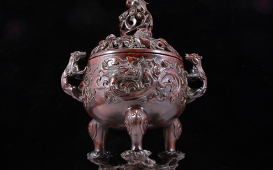 An exquisite agarwood carved dragon pattern two-eared three-legged incense burner with lid