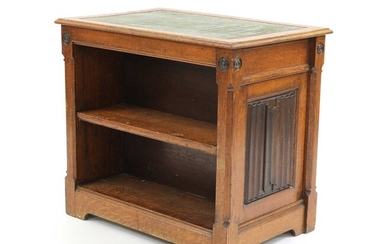 An oak Gothic Revival double-sided open bookcase