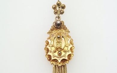 Antique gold pendant of a hat bell decorated with filigree...