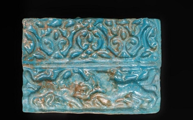 Arte Islamica A turquoise glazed Kashan moulded tile