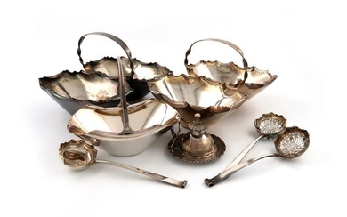 By Hukin and Heath, a collection of electroplated items, comprising: two cream and sugar baskets of shaped double oval form, crimped border, central carrying handle, with two sifting spoons and a cream ladle, a swing-handle sugar basket, plus a table...