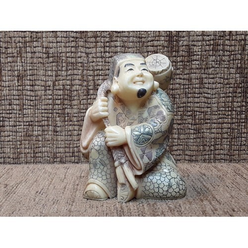 Chinese / Japanese ivory figure of a man carrying a barrel 1...