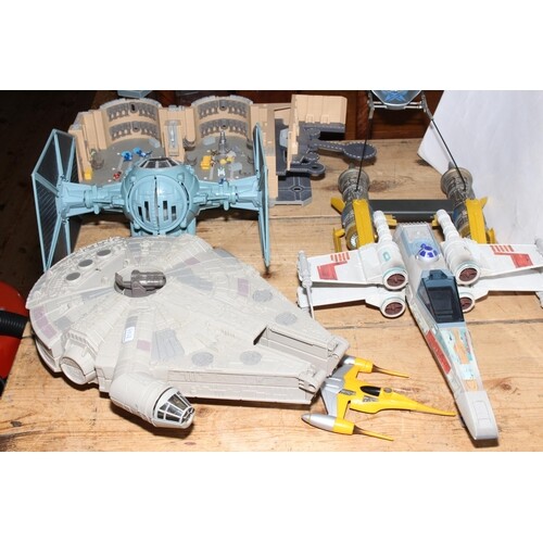 Collection of Star Wars toys including Millennium Falcon.