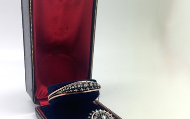 Demi-parure Napoléon III en or, argent et diamants, composée : - Bracelet rigide ajouré en...