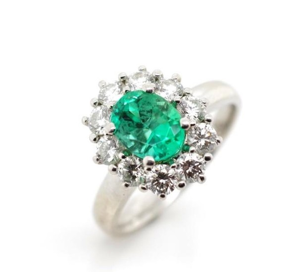 Emerald and diamond set platinum cluster ring, marked PT. Ap...