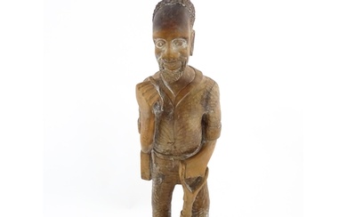Ethnographic / Native / Tribal: An African carved wood figur...