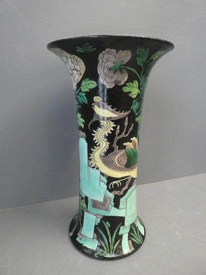 Famille vert vase decorated with a stylised crane on a black...
