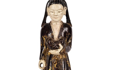 Figure orientale en bois sculpté, polychrome et avec des traces de dorure. Elle représente un...