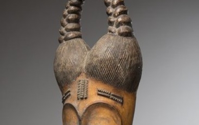 GOURO/BAOULE, Ivory Coast. Family mask with double bun...