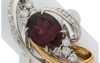 Garnet, Diamond, Platinum, Gold Ring Stones: Oval-shaped pyrope-almandine garnet...