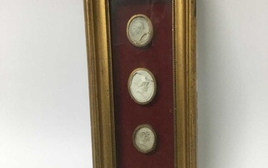 Group of four 19th century Grand Tour framed plaster cameos, the largest approximately 3.5cm high, with gilt borders, in box frame