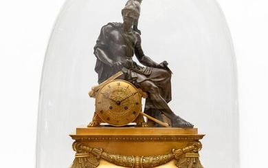 Importante pendule en bronze doré et patiné ornée d'une figure de Mars, tenant d'une main...