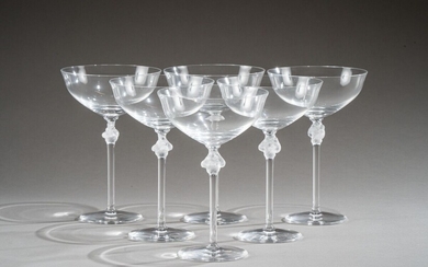 LALIQUE CRYSTAL Suite of six "Roxane" champagne glasses. White pressed crystal proofs, satin and glossy. Signed. Height 17 cm Bibliography: commercial catalogue of the Lalique house, Paris, 1977, model referenced and reproduced on plate T26. (One...