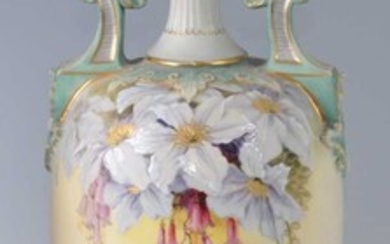 A late Victorian Royal Worcester porcelain twin handled pedestal vase