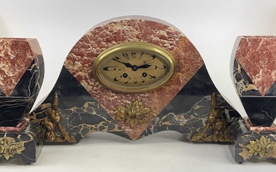 Lot details An Art Deco rouge marble three-piece clock garniture,...