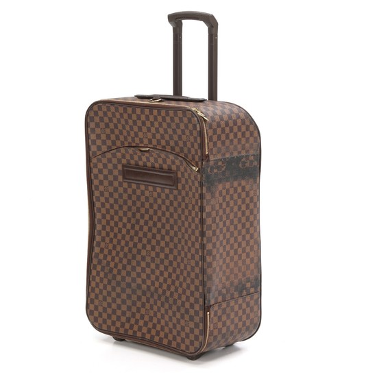 Louis Vuitton: A “Valise Pegase” suitcase made of brown Damier Ebene canvas, one large compartment, two zipped pockets. H 70 x L 4 x B 25 cm.