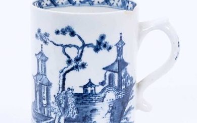 Lowestoft mug, of small cylindrical form with a scrolled handle, printed in blue with a Chinese river landscape, a diaper border below the interior rim, 8.8cm high