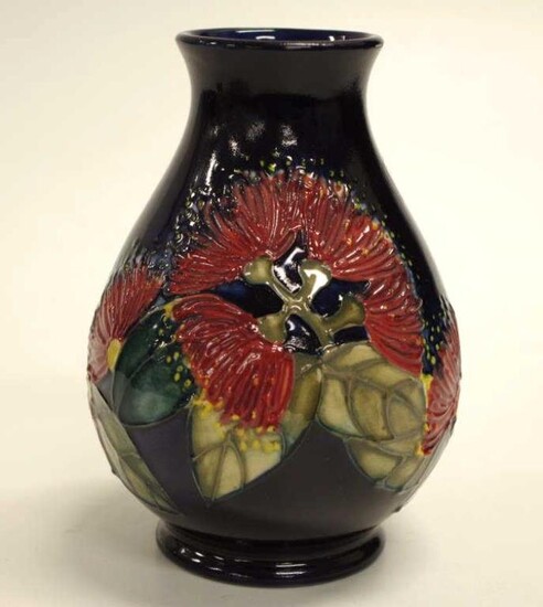 Moorcroft 'Flowering Gum' vase decorated on dark blue ground,...