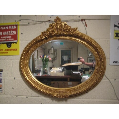 Oval Gilt Framed Mirror with carved Frame
