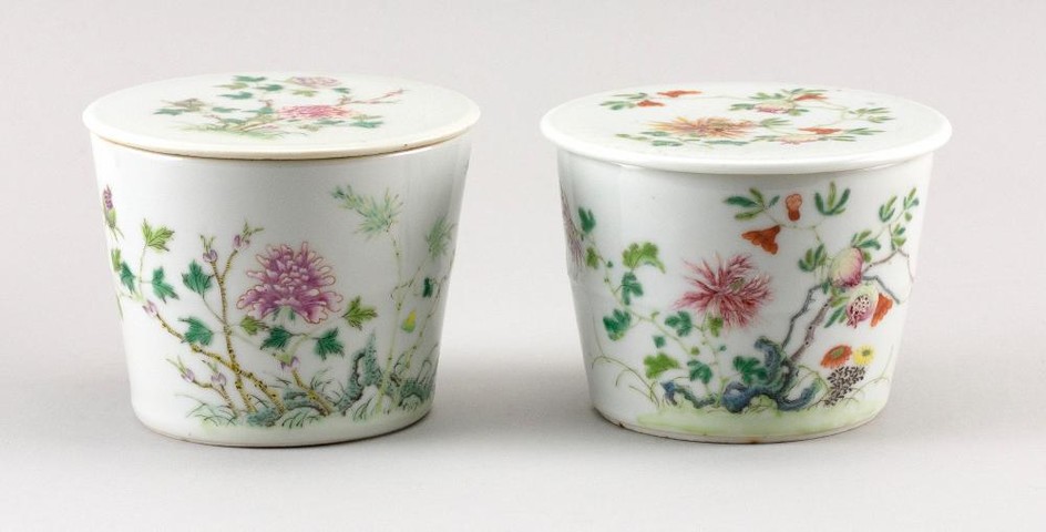 PAIR OF CHINESE FAMILLE ROSE PORCELAIN COVERED JARS In tapered cylindrical form, with enameled peony and pomegranate decoration. Six...