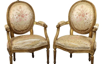 Pair of French Louis XVI style giltwood armchairs