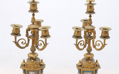 Pair of Louis XVI style candelabra in gilt bronze with Sèvres-like porcelain plaques, late 20th Century.