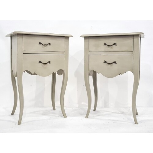 Pair of modern bedside tables with shaped tops and moulded e...