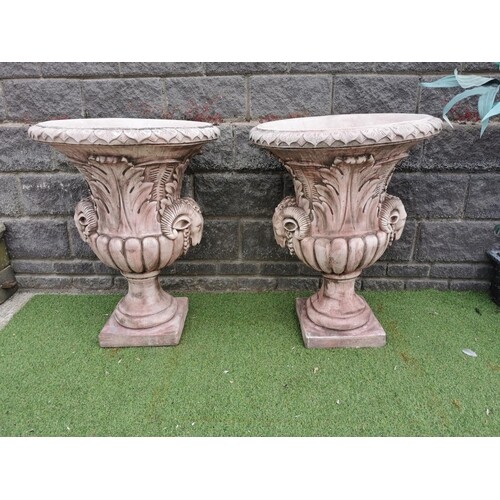 Pair of moulded stone Urns decorated with rams heads in the ...