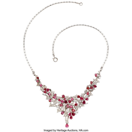 Ruby, Diamond, White Gold Necklace The necklace features pear-shaped...