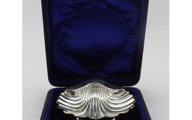Silver shell shaped butter dish plus silver butter knife in ...