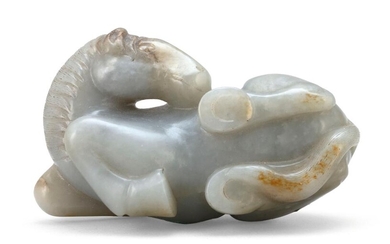 GRAY AND RUSSET JADE CARVING OF A RECUMBENT...