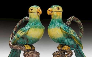 THREE FAIENCE JUGS IN THE SHAPE OF PARROTS, WITH HANDLES