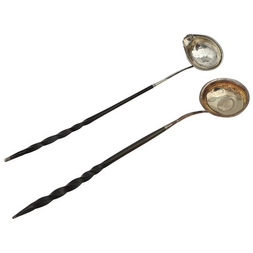 TWO GEORGE III SILVER TODDY LADLES, both with twist handles,...