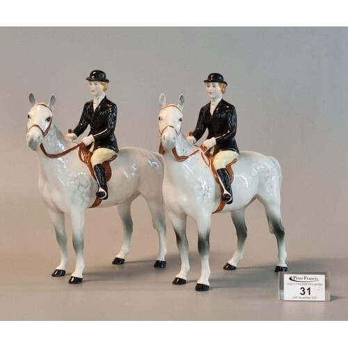 Two Beswick huntswomen on dapple grey horses, ladies with bl...