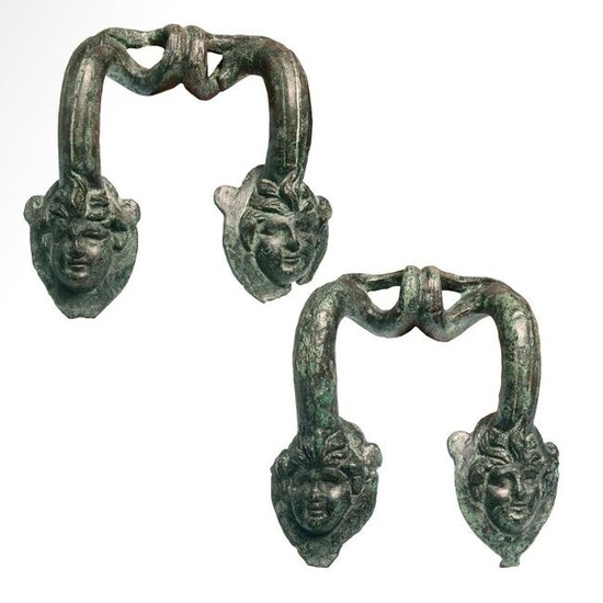 Two Greek Bronze Hydria Handles with Heads of Pans