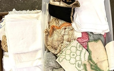 Two large boxes of assorted linens and related material, including place mats and other table