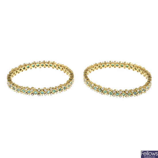 Two vari-cut emerald and brilliant-cut diamond bangles.