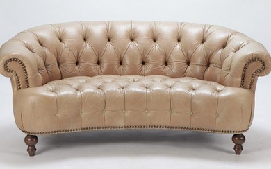 Unusual crescent shaped leather Chesterfield sofa with button upholstery. Ht: 31" Wd: 71.5" Dpth